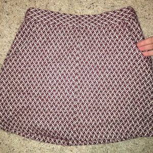 Skirt with pockets. Burgundy and cream